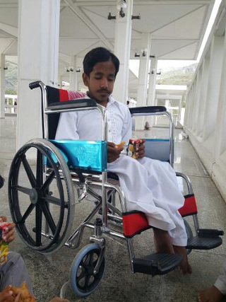 Qasim in wheelchair